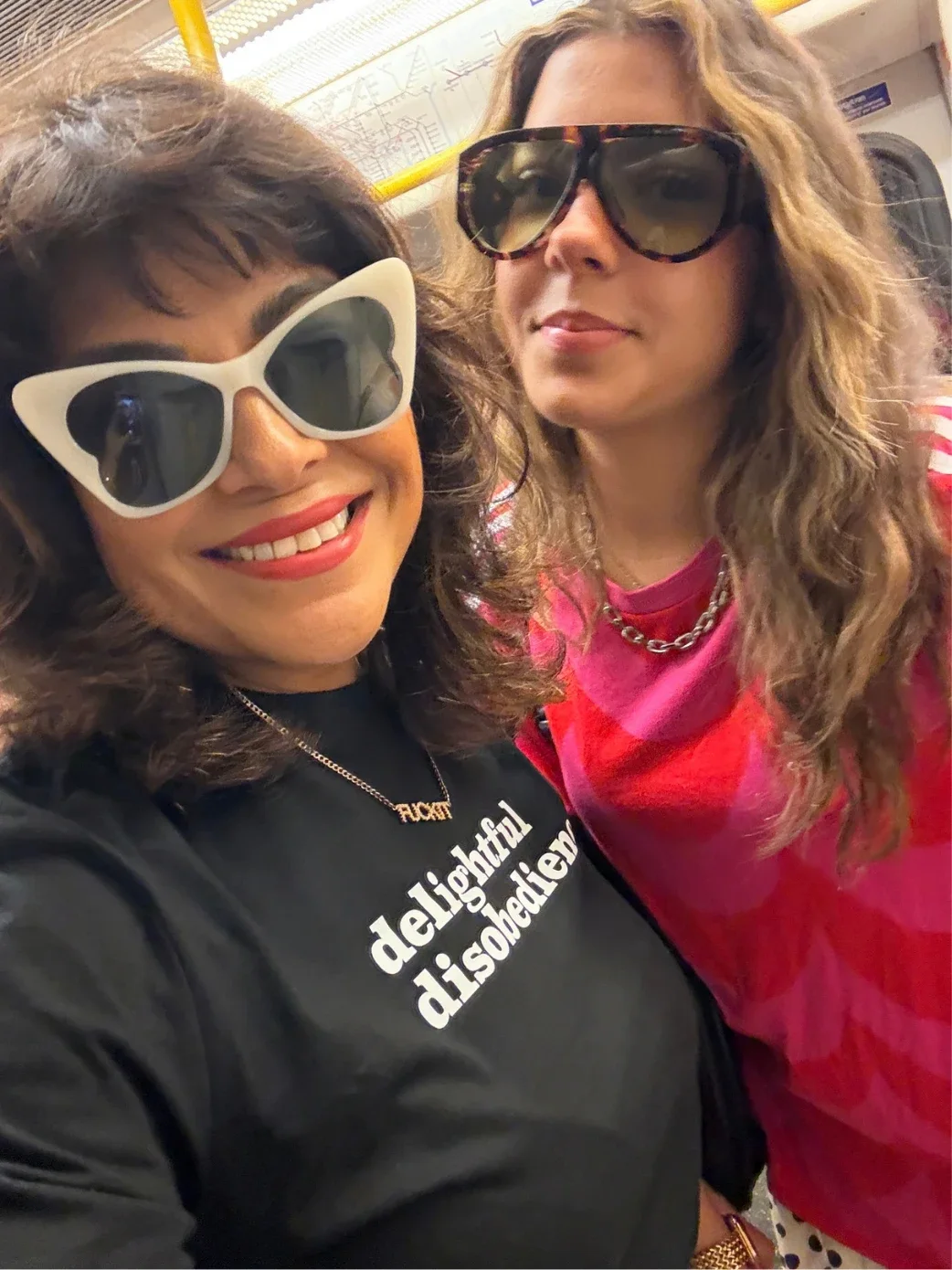 Nishma and Anushka in big sunglasses on the Tube